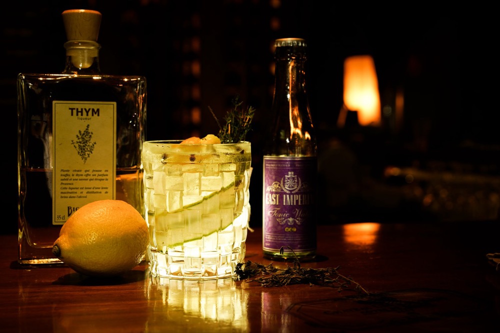Craft cocktail with lemon and thyme